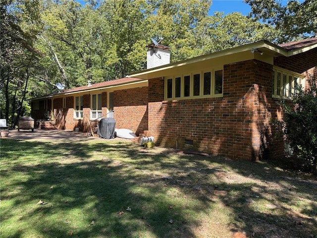 467 Southview Dr, Auburn, AL 36830 - view of home's exterior with a lawn and a patio