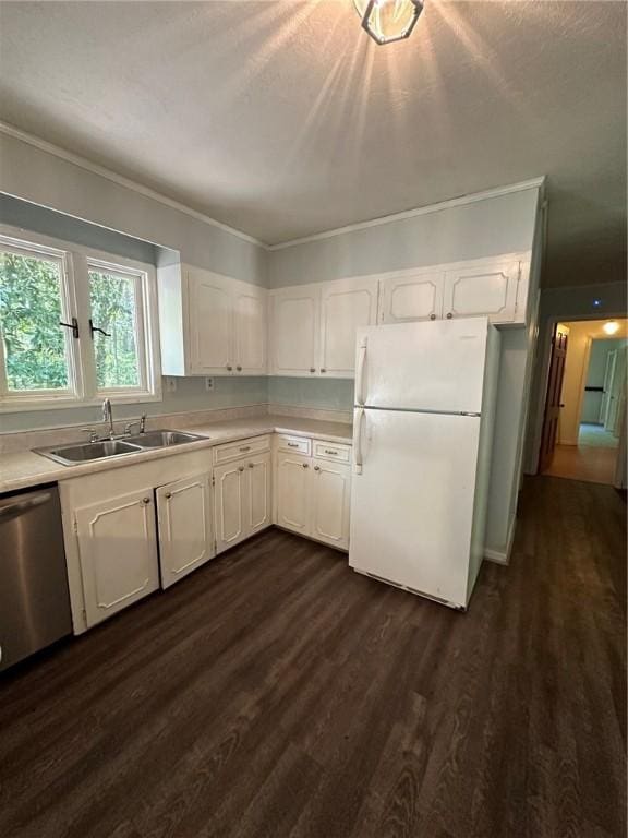 467 Southview Dr, Auburn, AL 36830 - kitchen with sink, stainless steel dishwasher, white fridge, dark hardwood / wood-style flooring, and white cabinetry