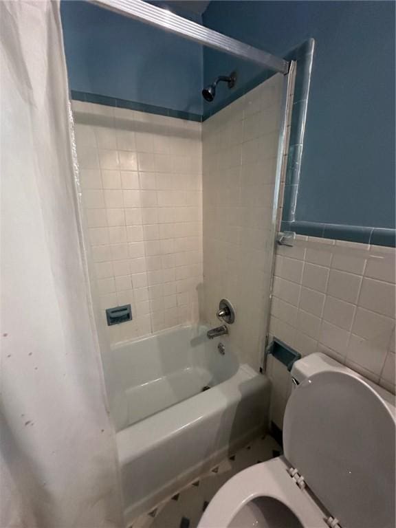 467 Southview Dr, Auburn, AL 36830 - bathroom featuring shower / tub combo, toilet, and tile walls