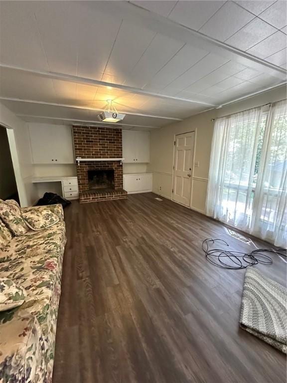 467 Southview Dr, Auburn, AL 36830 - living room featuring a fireplace and dark wood-type flooring
