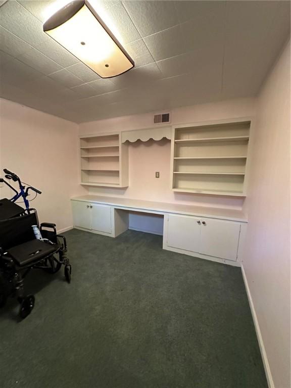 467 Southview Dr, Auburn, AL 36830 - unfurnished office with built in features, built in desk, and dark colored carpet