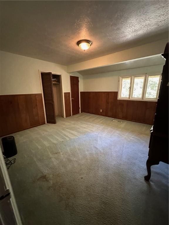 467 Southview Dr, Auburn, AL 36830 - empty room with light colored carpet and a textured ceiling