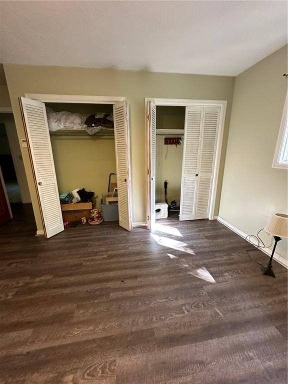 467 Southview Dr, Auburn, AL 36830 - bedroom with multiple closets and dark hardwood / wood-style floors