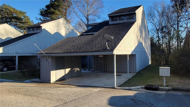 exterior space with roof with shingles