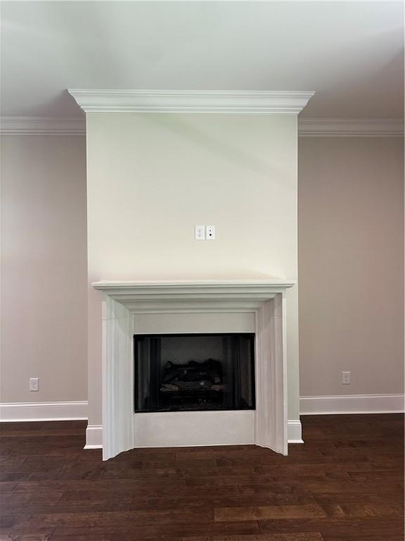 489 Windsor Dr, Opelika, AL 36801 - detailed view of crown molding, wood finished floors, and a fireplace