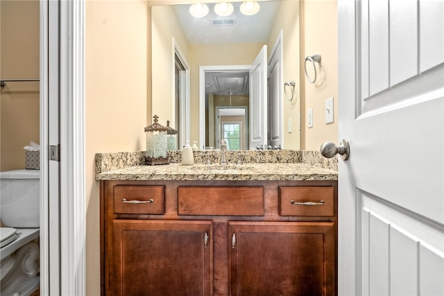 2422 Antler Ridge Dr, Auburn, AL 36832 - bathroom featuring toilet, vanity, and visible vents