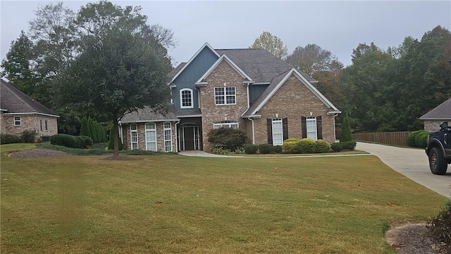 view of property featuring a front yard