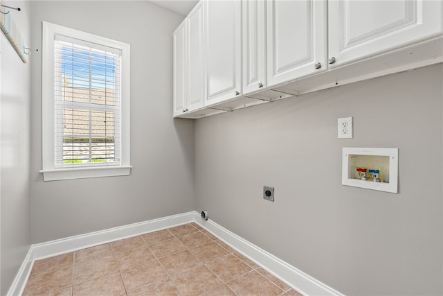 laundry area with cabinets, washer hookup, hookup for an electric dryer, and light tile patterned flooring