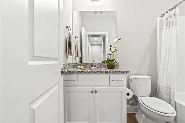 bathroom featuring shower / bath combo, visible vents, toilet, and vanity