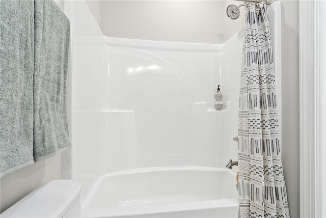 bathroom with toilet and shower / bath combination with curtain