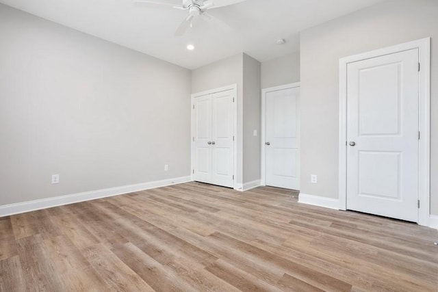 unfurnished bedroom featuring light hardwood / wood-style flooring and ceiling fan