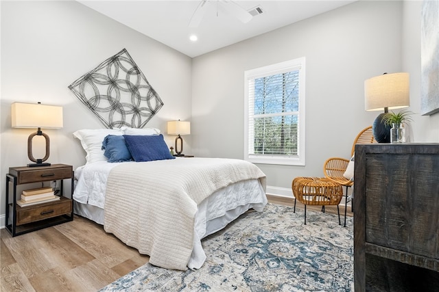 bedroom featuring light wood-style flooring, recessed lighting, baseboards, and visible vents