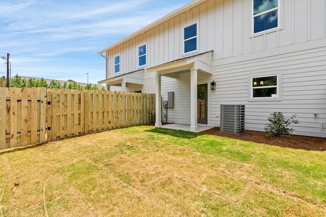 3260 Academy Dr Unit 510, Opelika, AL 36801 - back of house with board and batten siding, central AC unit, and a patio area