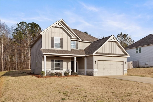 craftsman inspired home featuring driveway, a front lawn, stone siding, a garage, and board and batten siding