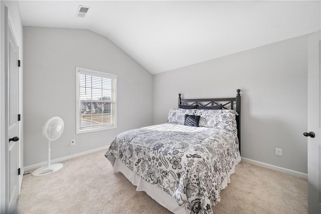 carpeted bedroom featuring visible vents, baseboards, and vaulted ceiling