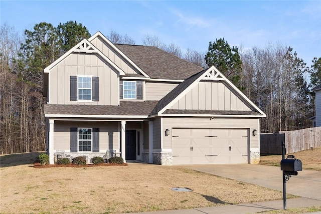 craftsman inspired home with board and batten siding, concrete driveway, roof with shingles, and fence