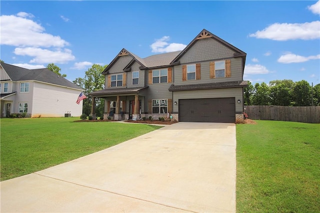 craftsman-style house featuring a front yard, a porch, and a garage