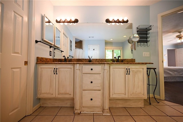 1765 Creekwood Trl, Auburn, AL 36830 - bathroom featuring tile patterned flooring, double vanity, ceiling fan, and ensuite bath