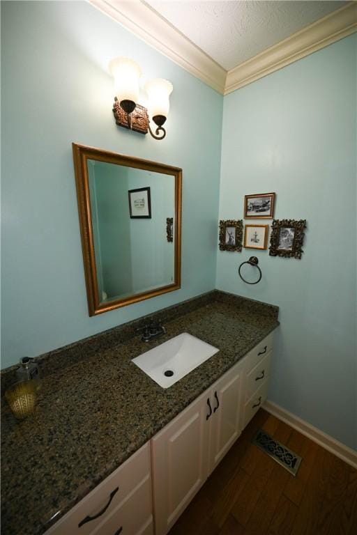 1765 Creekwood Trl, Auburn, AL 36830 - bathroom with ornamental molding, wood finished floors, and vanity