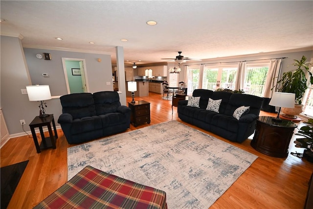 1765 Creekwood Trl, Auburn, AL 36830 - living area with crown molding, ceiling fan, and light wood-style floors