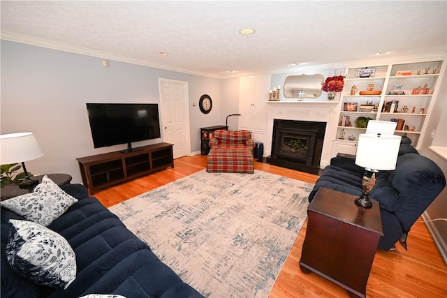 1765 Creekwood Trl, Auburn, AL 36830 - living room with crown molding, wood finished floors, a fireplace, and recessed lighting