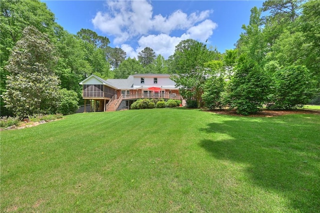 1765 Creekwood Trl, Auburn, AL 36830 - view of grassy yard with stairs, a sunroom, and a deck