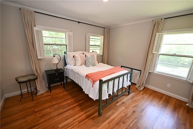510 S Dean Rd, Auburn, AL 36830 - bedroom with crown molding and light wood-style floors