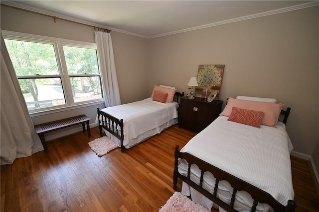 510 S Dean Rd, Auburn, AL 36830 - bedroom with ornamental molding, wood finished floors, and radiator