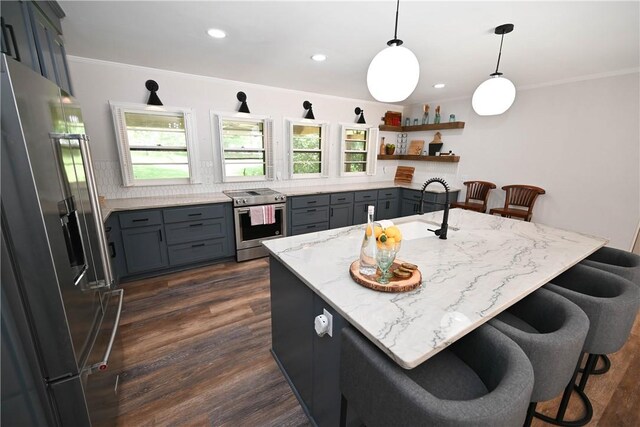 510 S Dean Rd, Auburn, AL 36830 - kitchen featuring appliances with stainless steel finishes, gray cabinets, a kitchen bar, dark wood-style floors, and crown molding