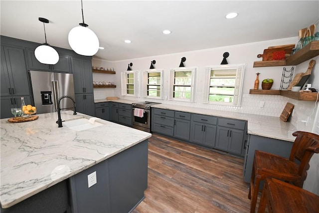 510 S Dean Rd, Auburn, AL 36830 - kitchen featuring appliances with stainless steel finishes, open shelves, backsplash, dark wood finished floors, and light stone countertops