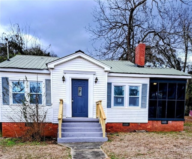 bungalow featuring a sunroom