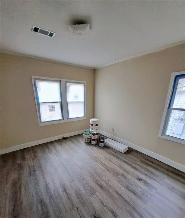 empty room with hardwood / wood-style floors