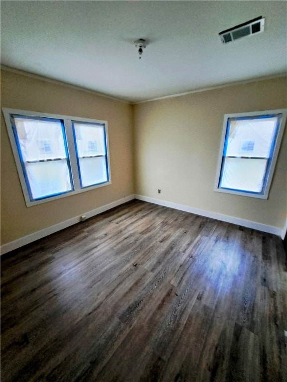 unfurnished room featuring dark hardwood / wood-style flooring