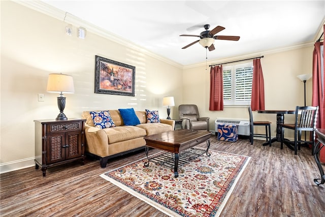 living area featuring a ceiling fan, baseboards, crown molding, and wood finished floors