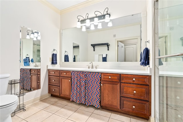 full bathroom featuring toilet, vanity, ornamental molding, and tile patterned floors