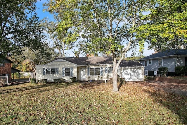 ranch-style home featuring a front yard