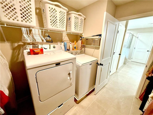 laundry area with laundry area and separate washer and dryer