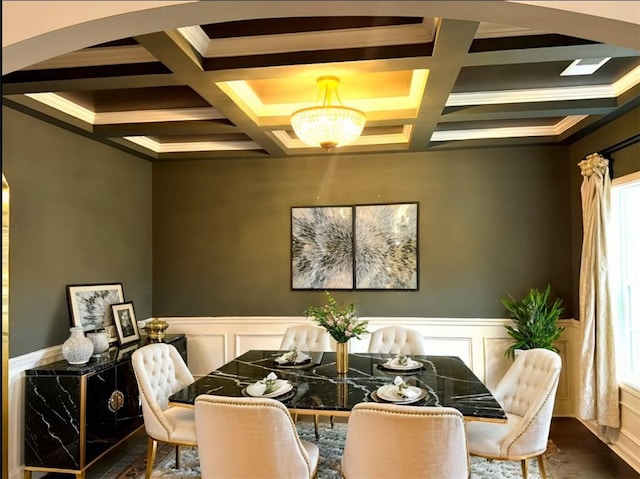 dining room featuring beam ceiling, coffered ceiling, and a wealth of natural light