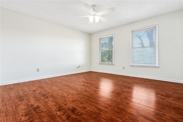 empty room with ceiling fan and hardwood / wood-style flooring