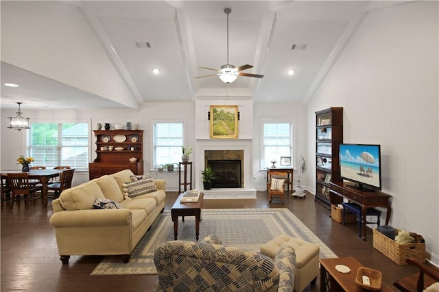 518 High Dr, Opelika, AL 36804 - living area with dark wood-type flooring, a ceiling fan, a fireplace with raised hearth, beam ceiling, and a chandelier