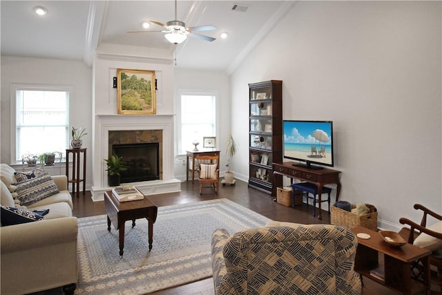 518 High Dr, Opelika, AL 36804 - living area with a tiled fireplace, a ceiling fan, vaulted ceiling, baseboards, and ornamental molding