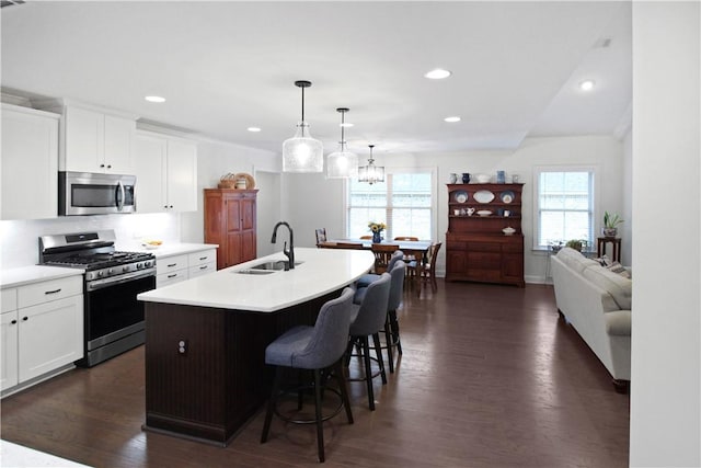 518 High Dr, Opelika, AL 36804 - kitchen with appliances with stainless steel finishes, a sink, healthy amount of natural light, a kitchen island with sink, and recessed lighting