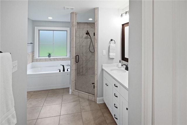 518 High Dr, Opelika, AL 36804 - bathroom with vanity, a shower stall, a bath, tile patterned floors, and recessed lighting
