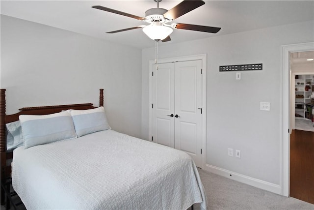 518 High Dr, Opelika, AL 36804 - carpeted bedroom featuring a closet, baseboards, and ceiling fan