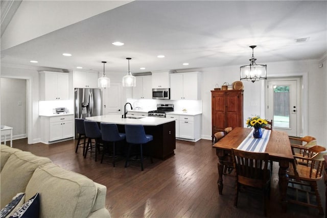 518 High Dr, Opelika, AL 36804 - kitchen featuring stainless steel appliances, a sink, a kitchen bar, a chandelier, and open floor plan
