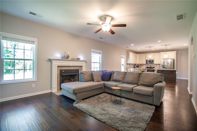 2647 Dunkirk Cir, Auburn, AL 36832 - living area with ceiling fan, baseboards, a tiled fireplace, recessed lighting, and dark wood-type flooring