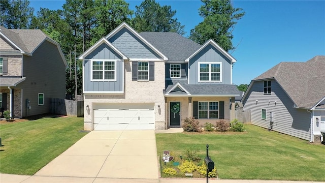 2647 Dunkirk Cir, Auburn, AL 36832 - craftsman-style house with board and batten siding, an attached garage, driveway, brick siding, and a shingled roof