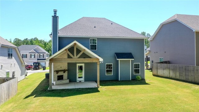 2647 Dunkirk Cir, Auburn, AL 36832 - back of property featuring a patio, a chimney, and a fireplace with raised hearth