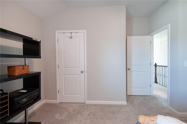 2647 Dunkirk Cir, Auburn, AL 36832 - unfurnished bedroom featuring carpet, vaulted ceiling, and baseboards
