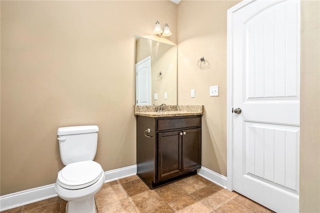 2316 Tuscany Pl, Auburn, AL 36830 - bathroom featuring toilet, vanity, and baseboards